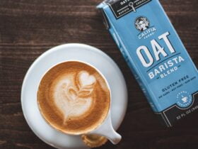 coffee with oat milk and oat milk carton