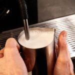 frothing milk with espresso machine steam wand