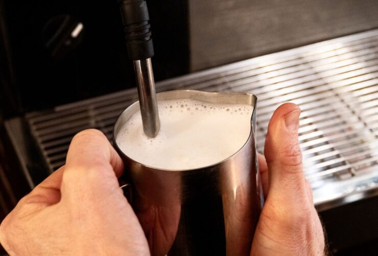 frothing milk with espresso machine steam wand