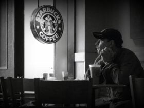 man at starbucks looking out of the window